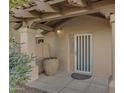 Inviting front entry with a decorative door and large pot at 5777 N 78Th Pl, Scottsdale, AZ 85250