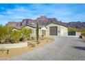 Desert home with a 3-car garage and beautiful mountain backdrop at 605 N Star Ct, Apache Junction, AZ 85119