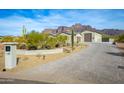 Luxury desert home with 3-car garage and paved driveway at 605 N Star Ct, Apache Junction, AZ 85119