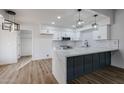 Modern kitchen featuring white shaker cabinets and a large island at 619 N Norfolk --, Mesa, AZ 85205