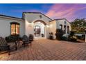 Inviting front patio with brick pavers and comfortable seating area at 6601 E Valley Vista Ln, Paradise Valley, AZ 85253