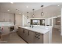 Modern kitchen with large island, stainless steel appliances, and wine cooler at 7175 E Camelback Rd # 601, Scottsdale, AZ 85251