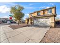 Two-story house with a two-car garage and driveway at 7504 S Sundown Ct, Buckeye, AZ 85326