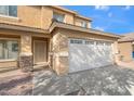 Two-story house with a two-car garage and front entrance at 7504 S Sundown Ct, Buckeye, AZ 85326