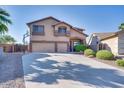 Two-story house with a three-car garage and a basketball hoop at 9022 W Ross Ave, Peoria, AZ 85382