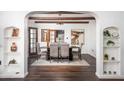 Bright dining room with hardwood floors and built-in shelving at 903 W Mackenzie Dr, Phoenix, AZ 85013