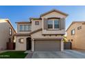 Two-story house with gray garage door and landscaping at 9823 E Escondido Ave, Mesa, AZ 85208