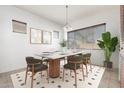 Elegant dining room with a modern table and stylish chairs at 10542 E Simone Ave, Mesa, AZ 85212