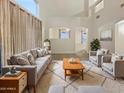 Spacious living room with ample natural light and comfy seating at 13033 W Avalon Dr, Avondale, AZ 85392