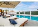Relaxing pool area with lounge chairs and umbrellas at 1720 W Sunnyslope Ln, Phoenix, AZ 85021