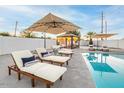 Inviting backyard oasis featuring a refreshing pool, lounge chairs, and a pergola at 1720 W Sunnyslope Ln, Phoenix, AZ 85021