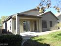 Covered patio, grassy backyard, and block wall at 26811 N 41St Ct, Cave Creek, AZ 85331