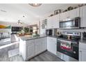 Modern kitchen with stainless steel appliances and granite countertops at 307 E Impala Ct, Casa Grande, AZ 85122