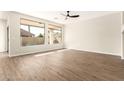 Bright living room featuring hardwood floors and large windows at 3143 E Morenci Rd, San Tan Valley, AZ 85143