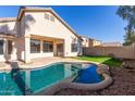 Inviting kidney-shaped pool with a relaxing patio area at 3143 E Morenci Rd, San Tan Valley, AZ 85143