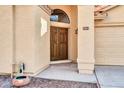 Double wood doors with decorative accents at 3531 N 108Th Ave, Avondale, AZ 85392