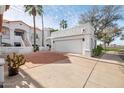 Attached garage with a terracotta paved driveway at 6117 N 28Th Pl, Phoenix, AZ 85016