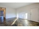 Open living space with tile floors and entryway at 6920 E 4Th St # 105, Scottsdale, AZ 85251