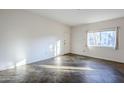 Bright living room with tile floors and large window at 6920 E 4Th St # 105, Scottsdale, AZ 85251