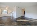 Living room with tile floors and access to kitchen at 6920 E 4Th St # 105, Scottsdale, AZ 85251
