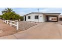 Front view of updated manufactured home with carport at 1031 S 98Th St, Mesa, AZ 85208