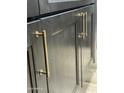 Dark kitchen cabinets with brushed gold hardware at 1223 E Villa Rita Dr, Phoenix, AZ 85022