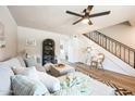 Living room with sectional sofa, wood-look floors, and a ceiling fan at 1531 W Colter St # 7, Phoenix, AZ 85015