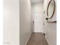 Bright entryway with tile flooring and a modern mirror at 1710 E Palo Verde St, Gilbert, AZ 85296