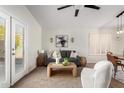 Living room with grey sofa and access to patio at 1710 E Palo Verde St, Gilbert, AZ 85296