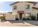 Front view of a two-story stucco home with a red awning at 1817 E Hayward Ave # 3, Phoenix, AZ 85020