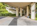 Covered walkway and driveway leading to the house entrance at 2124 E Virginia St, Mesa, AZ 85213