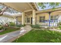 Charming house entrance with covered porch and lush landscaping at 2124 E Virginia St, Mesa, AZ 85213