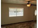 Bright living room featuring tile floors and a large window at 2270 S Apache Dr, Apache Junction, AZ 85120