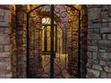 Elegant wrought iron gate leading to a stone courtyard at 3257 N Piedra Cir, Mesa, AZ 85207