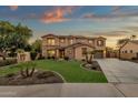 Two-story house with stone accents and a landscaped yard at dusk at 3829 E Sawtooth Dr, Chandler, AZ 85249