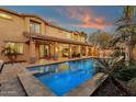 Resort-style pool and spa with covered patio and outdoor kitchen at 3829 E Sawtooth Dr, Chandler, AZ 85249