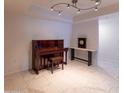 Living room with piano and tile floor at 4200 N Miller Rd # 121, Scottsdale, AZ 85251