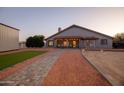 Landscaped backyard with a patio and pathway at 510 E Desert Hills Estate Dr, Phoenix, AZ 85086