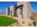 Stylish home exterior with desert landscaping and modern accents at 5740 E Moura Dr, Cave Creek, AZ 85331