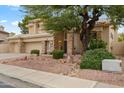 Two-story house with stone accents and mature trees at 6210 W Foothill Dr, Glendale, AZ 85310