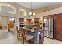 Gourmet kitchen boasts stainless steel appliances and an island at 6210 W Foothill Dr, Glendale, AZ 85310