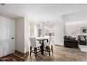 Bright dining area with a small table and four chairs, near the kitchen at 7402 E Carefree Dr # 113, Carefree, AZ 85377