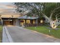 Modern home with a long driveway and carport at 840 W Earll Dr, Phoenix, AZ 85013