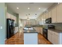 Spacious kitchen with an island and stainless steel appliances at 9754 E Natal Ave, Mesa, AZ 85209