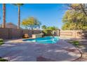 Relaxing kidney-shaped pool with flagstone decking at 9754 E Natal Ave, Mesa, AZ 85209