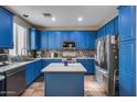 Bright kitchen with blue cabinets and a large island at 1323 E Frances Ln, Gilbert, AZ 85295