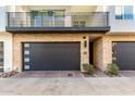 Townhouse exterior featuring a private entrance and attached garage at 1717 E Morten Ave # 23, Phoenix, AZ 85020