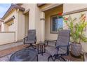 Small patio with two chairs and a side table at 17937 W Cedarwood Ln, Goodyear, AZ 85338