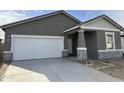 New construction home with stone accents and a two-car garage at 1907 E Harness Ln, San Tan Valley, AZ 85140