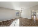 Bright dining room with hardwood floors and chandelier at 19912 N Toledo Ave, Maricopa, AZ 85138